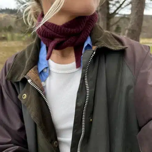 Woman wearing burgundy red scarf sophie scarf